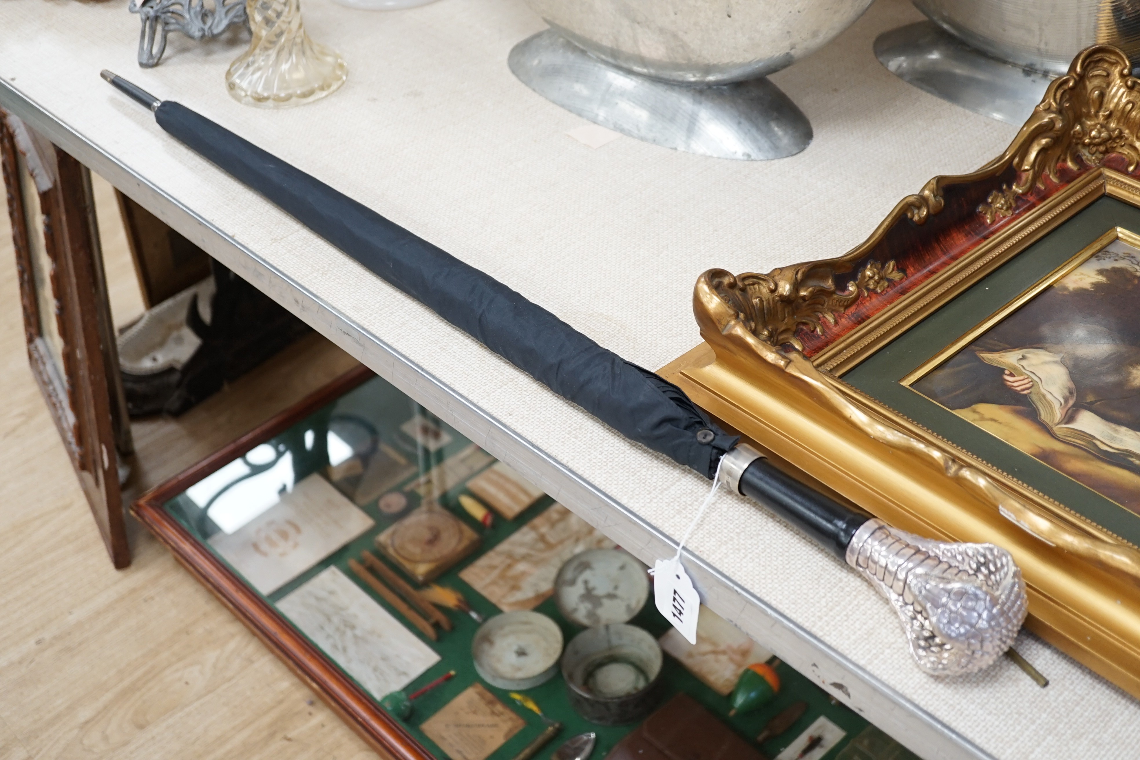 A Jeffery West umbrella with silver cobra handle,94cmslong